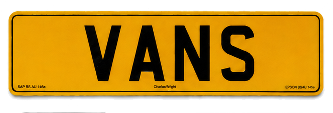 Yellow British rear plate reading VANS — classic and specialist van storage
